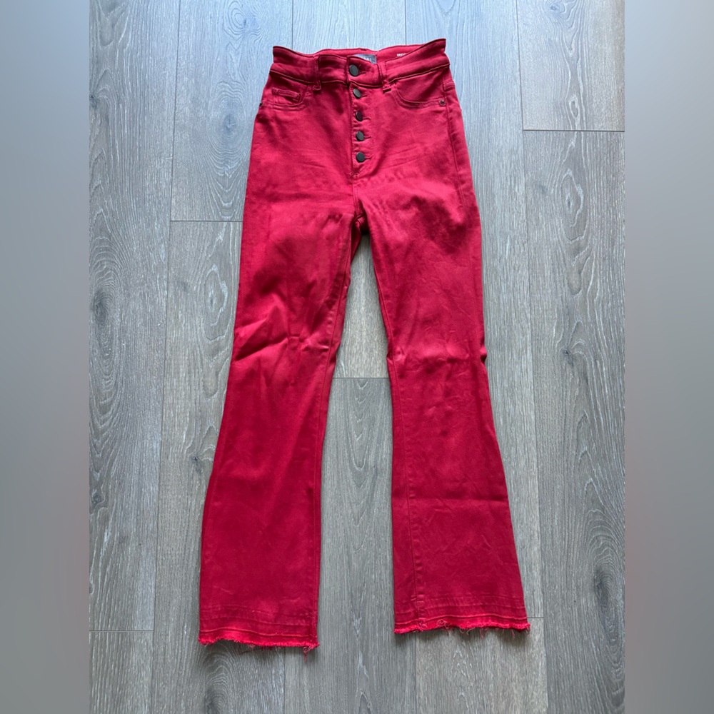 Red cropped bootcut jeans with button details